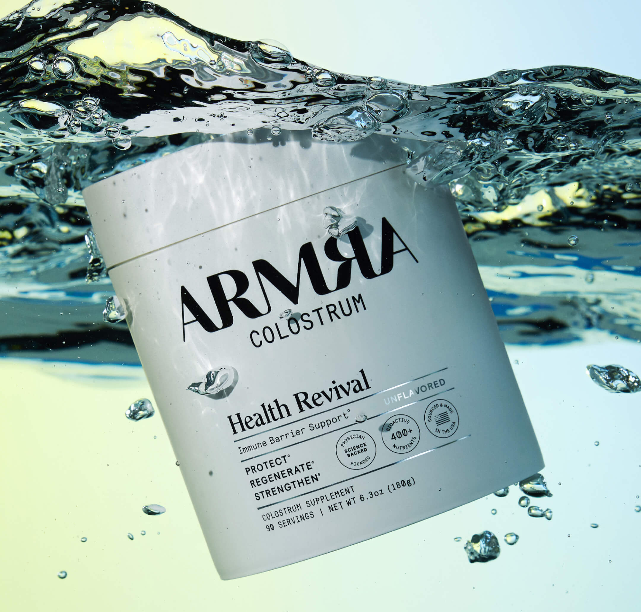 ARMRA Colostrum Health Revival  container with water splash background