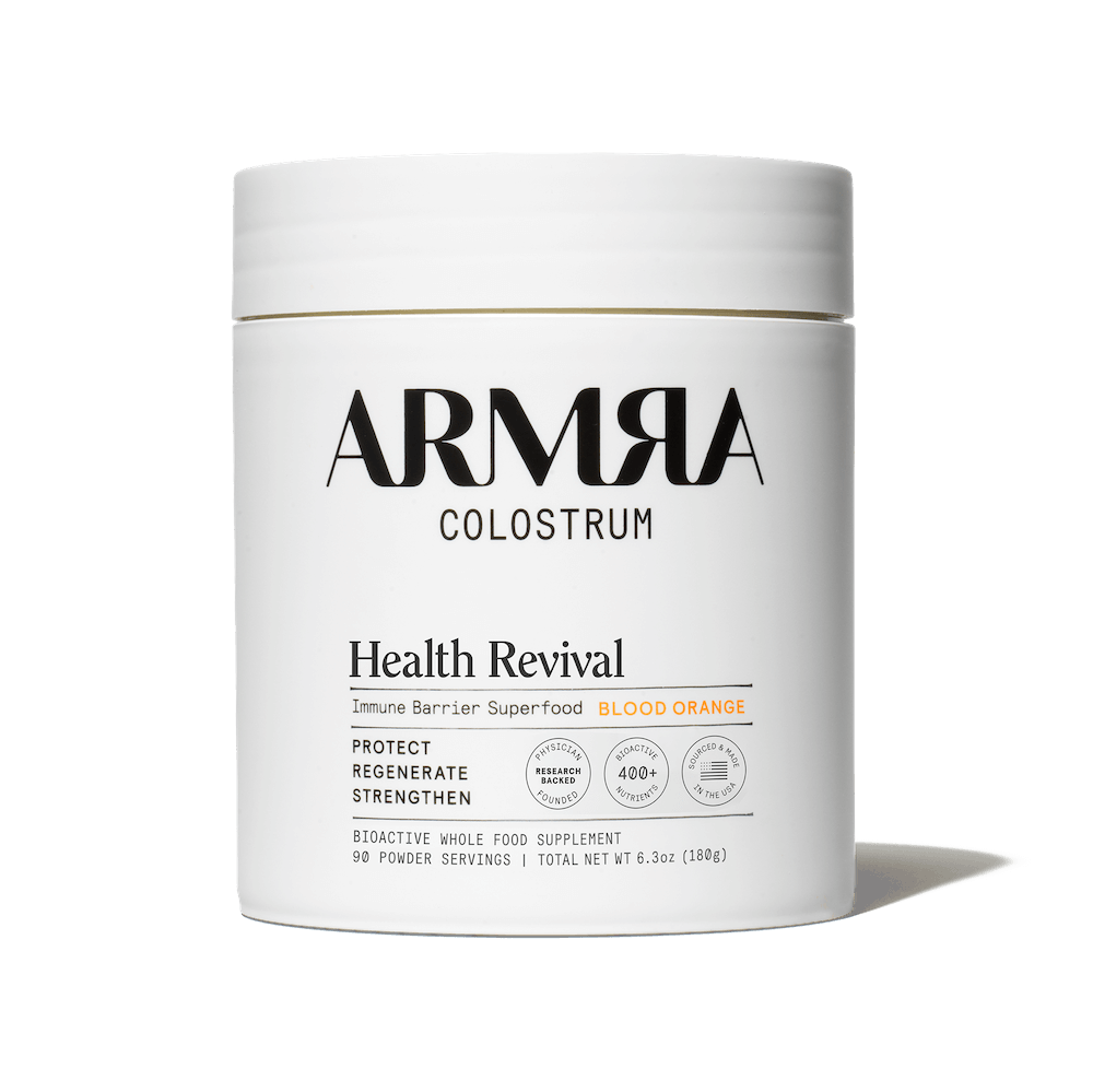 ARMRA Colostrum Health Revival supplement container on a black background