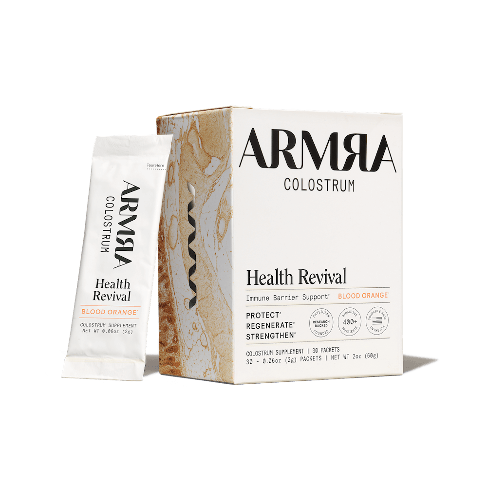 ARMRA Colostrum Health Revival package on a black background